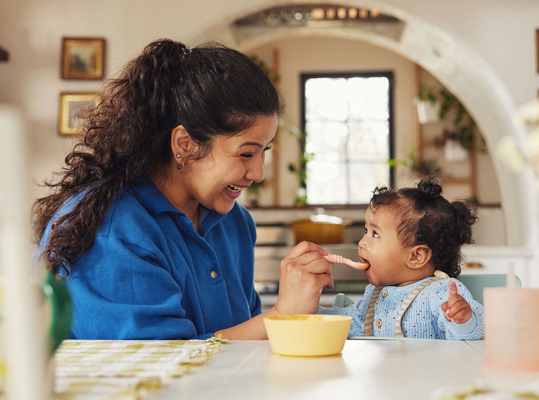 parent feeding baby