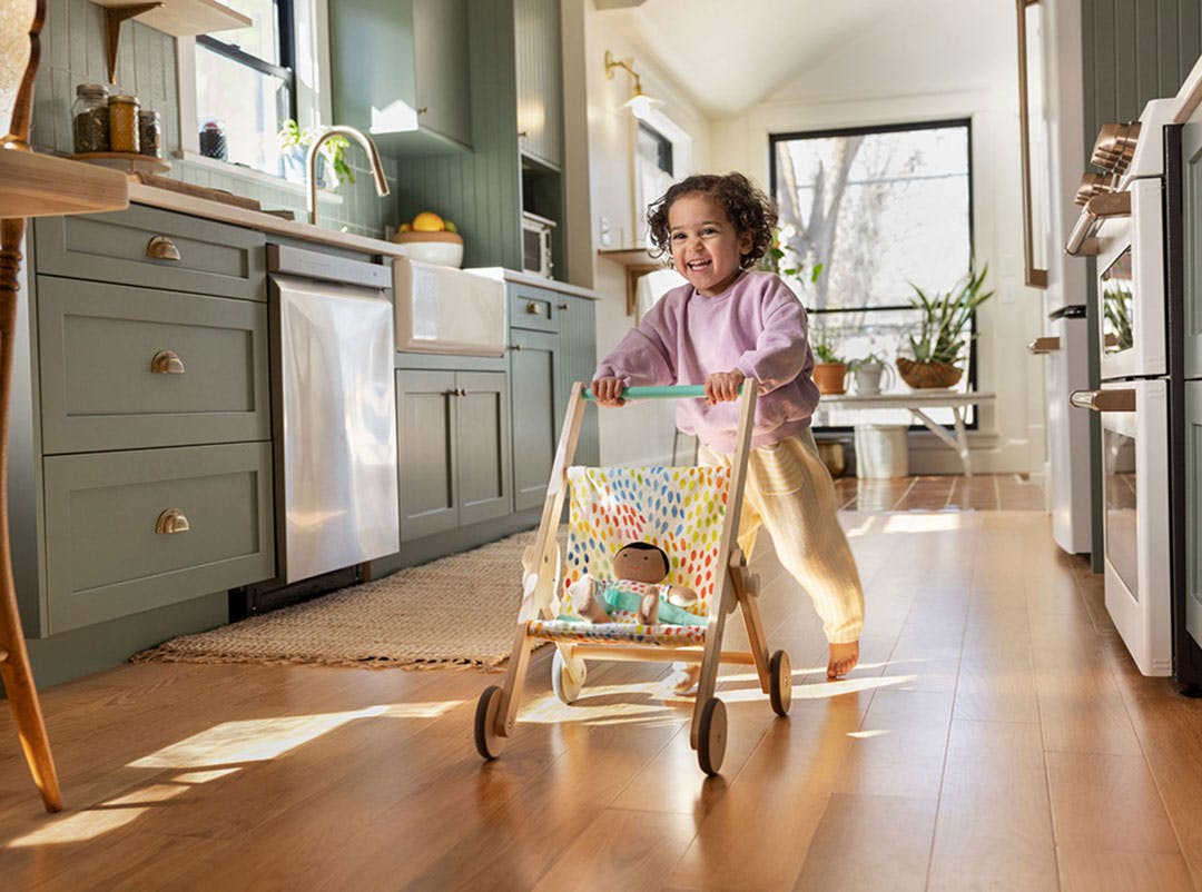 girl pushing stroller