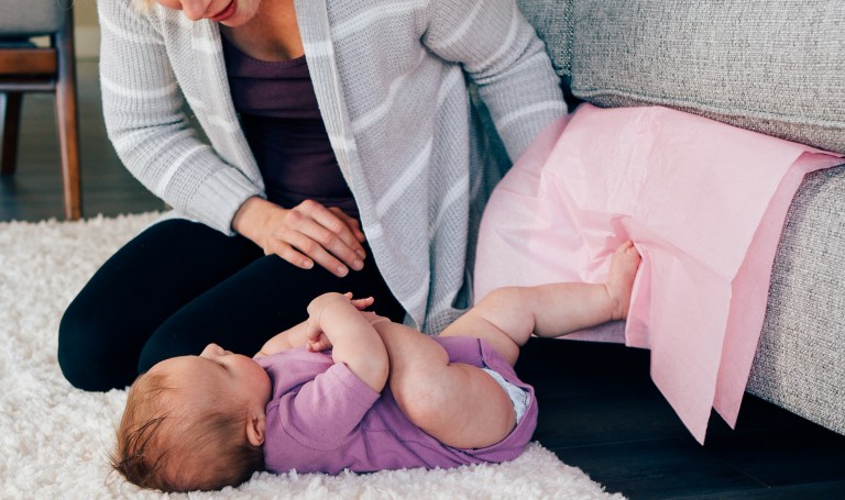 Baby kicking tissue paper