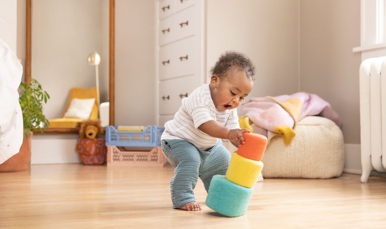 Child playing with the Felt Baskets by Lovevery