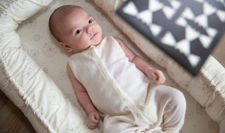 Baby looking up at Black and White cards by Lovevery