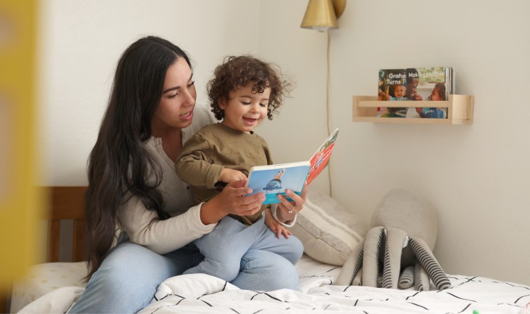 Mother read and child together in bed