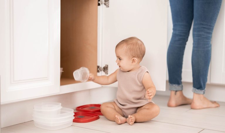 Baby playing in the kitchen