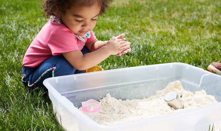 A child plays with sand