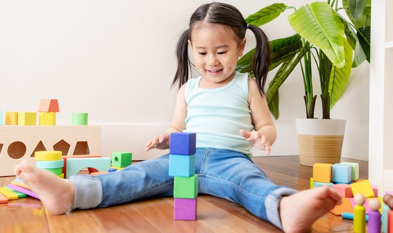 Young child playing with the Block Set by Lovevery