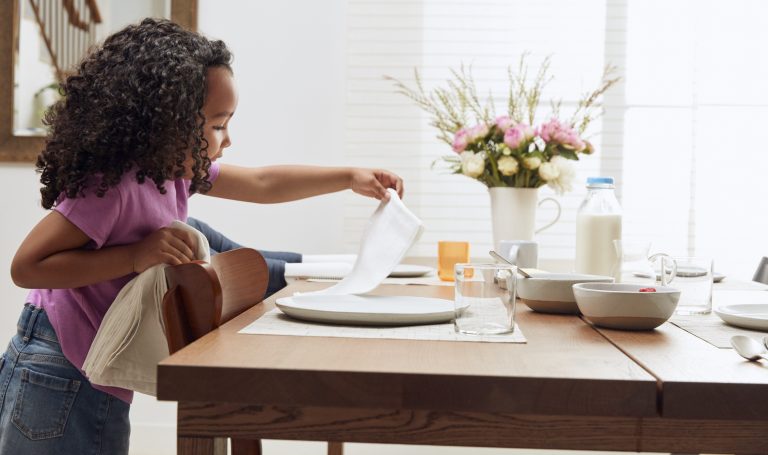 Child setting the table