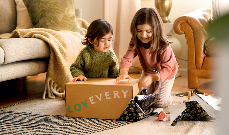 Two kids opening a Lovevery box